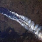 RE-TRANS FOR HIGHER RESOLUTION - This Tuesday Jan. 8, 2013 photo provided by NASA, taken by Astronaut Chris Hadfield from the International Space Station, shows a view of the wildfire near Burrinjuck Dam in Australia. Look closely and you can se...