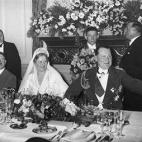 10th April 1935: Prussian premier and Reich Air Minister Hermann Goering (1893 - 1946) (R) and his bride, German actor Emmy Sonnemann (1893 - 1973), are joined by German Fuhrer Adolf Hitler (1889 - 1945) (L) at a banquet table during their weddi...