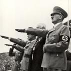 BERLIN - AUGUST 1: Adolf Hitler and his staff salute the teams during the opening ceremonies of the XI Olympic Games on August 1, 936 in Berlin, Germany. (Photo by Getty Images)