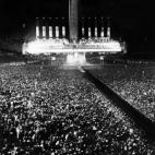One million people gather in Berlin's Olympic Stadium and adjoining Mayfield, 28 September 1937, to hear speeches of German führer Adolf Hitler and Italian leader Benito Mussolini, who claim the alliance between Italy and Germany. Benito Mussol...
