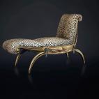 Este "lit de repos" con respaldo y reposapiés reclinable, de madera tallada y dorada, con motivos de drapeado y pompones de bronce se vendió por 421.000 euros, algo más de su precio de salida. Armand Albert Rateau, 1921–1925.