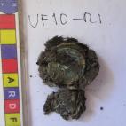 Monedas con restos textiles.