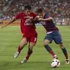 Thailands Adsak Kraisorn left , fights for the ball with FC Barcelonas Neymar during their friendly soccer match at Rajamangala national stadium in Bangkok, Thailand Wednesday, Aug . 7 , 2013. FC Barcelona beat Thailand 7-1.(AP Photo/Sakchai...