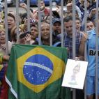 FC Barcelona supporters cheer their new signing Neymar upon his arrival at the club's office at the Camp Nou stadium in Barcelona, Spain, Monday, June 3, 2013. Neymar arrived in Barcelona on Monday to complete his deal with the Catalan club, whi...