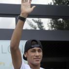 FC Barcelona's new signing Neymar gestures upon his arrival at the club's office at the Camp Nou stadium in Barcelona, Spain, Monday, June 3, 2013. Neymar arrived in Barcelona on Monday to complete his deal with the Catalan club, which will see ...