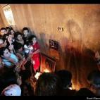 Crowds gathered around what many thought was an image of the Virgin Mary on the wall of a Chicago underpass in 2005.