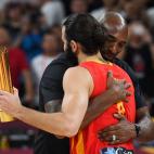 Former basketball player Kobe Bryant (L) of the US embraces Spain's Ricky Rubio after presenting him the man of the match trophy at the end of the Basketball World Cup final game between Argentina and Spain in Beijing on September 15, 2019. (Pho...