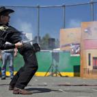 Nick Nica 'El Rápido', en Montreal, Quebec, en acción mientras apunta y dispara en una competición en el Campeonato Abierto de Canadá, en la Columbia Británica, el 21 de julio.