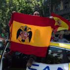 People holding Spanish flags take part on an in-vehicle protest against the Spanish government by Covid-19on May 23, 2020 in Madrid, Spain. Far right wing VOX party has called for in-vehicle protests across Spain against the Spanish government's...
