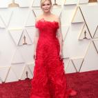 Con un vestido vintage de Lacroix.