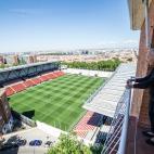 MADRID, SPAIN - JUNE 09: An older woman looks from her balcony at the Vallecas Stadium in the run-up to the outcome of the Liga Smartbank football match between Rayo Vallecano and Albacete BP,on June 09, 2020 in Madrid, Spain. The match was aban...