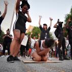 Demonstrators pray during a march, Sunday, May 31, 2020, in Atlanta. Protests continued following the death of George Floyd, who died after being restrained by Minneapolis police officers on May 25. (AP Photo/Mike Stewart)