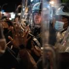 Police hold off protesters during a solidarity rally for George Floyd, Sunday, May 31, 2020, in the Brooklyn borough of New York. Protests were held throughout the city over the death of Floyd, a black man in police custody in Minneapolis who di...