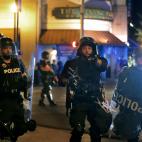 A police officer shouts to members of the media while trying to clear the streets of demonstrators in Memphis, Tennessee, early Monday, June 1, 2020, protesting the death of George Floyd who died in Minneapolis police custody May 25, 2020. (Da...