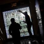 People break into a smoke shop on Monday, June 1, 2020, in New York. Protests were held throughout the city over the death of George Floyd, a black man in police custody in Minneapolis who died after being restrained by police officers on Memori...