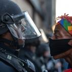 A protester confronts police during a rally in downtown Lexington, Ky., against the deaths of George Floyd and Breonna Taylor on Sunday, May 31, 2020. (Ryan C. Hermens/Lexington Herald-Leader via AP)