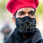 Nick Brentley demonstrates in San Francisco on Sunday, May 31, 2020, to protest the death of George Floyd, who died after being restrained by Minneapolis police officers on May 25. (AP Photo/Noah Berger)