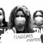 AUCKLAND, NEW ZEALAND - JUNE 01: (This image has been converted to black and white.) Protestors march down Queen Street on June 01, 2020 in Auckland, New Zealand. The rally was organised in solidarity with protests across the United States follo...