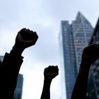 AUCKLAND, NEW ZEALAND - JUNE 01: Protestors march down Queen Street on June 01, 2020 in Auckland, New Zealand. The rally was organised in solidarity with protests across the United States following the killing of an unarmed black man George Floy...