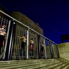 Activists of women's rights organisation Femen, are chained to the gate of Palacio Vistalegre, with the words "against fascist vote" painted on their body, early on October 6, 2019 in Madrid, during a protest against a campaign rally of Spanish ...