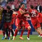 (FromL) Bayern Munich's French midfielder Mickael Cuisance, Bayern Munich's French forward Kingsley Coman, Bayern Munich's French midfielder Corentin Tolisso and Bayern Munich's German forward Thomas Mueller celebrate after winning the UEFA Cham...
