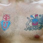 A Chile fan shows his tattoos prior to the 2014 FIFA World Cup Brazil Group B match between Chile and Australia at Arena Pantanal on June 13, 2014 in Cuiaba, Brazil. (Photo by Clive Brunskill/Getty Images)