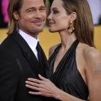 Actors Brad Pitt and Angelina Jolie arrive to the 18th Annual Screen Actors Guild Awards at the Shrine Auditorium in Los Angeles, California on January 29, 2012. AFP PHOTO / JOE KLAMAR (Photo credit should read JOE KLAMAR/AFP/Getty Images)