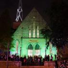 Protesters wait outside the First Unitarian church, Thursday, Sept. 24, 2020, in Louisville, Ky. Authorities pleaded for calm while activists vowed to fight on Thursday in Kentucky's largest city, where a gunman wounded two police officers durin...