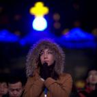 Fieles cristianos en la Misa del Gallo en Pekín, China. (AP Photo/Ng Han Guan)