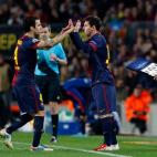 Barcelona's Lionel Messi, from Argentina,who started the game on the bench, replaces teammate Cesc Fabregas during the Champions League quarterfinal second leg soccer match between FC Barcelona and Paris Saint-Germain FC at the Camp Nou stadium ...