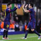 Barcelona's Lionel Messi, from Argentina, left, replaces Barcelona's Cesc Fabregas during the Champions League quarterfinal second leg soccer match between FC Barcelona and Paris Saint-Germain FC at the Camp Nou stadium in Barcelona, Spain, Wedn...