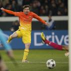 Barcelona's Lionel Messi scores the opening goal while Paris Saint Germain's goalkeeper Salvatore Sirigu of Italy looks on during their Champions League quarterfinal soccer match in Paris,Tuesday, April 2, 2013. (AP Photo/Christophe Ena)