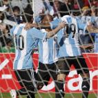 Argentina's Ever Banega, right, celebrates with his teammates Clemente Rodriguez, center, and Lionel Messi, after Ever scored a goal against Bolivia during a 2014 World Cup qualifying soccer game in La Paz, Bolivia, Tuesday, March 26, 2013. (AP ...