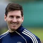 Argentina's forward Lionel Messi smiles during a training session in Ezeiza, Buenos Aires on March 19, 2013 ahead of the Brazil 2014 FIFA World Cup South American qualifier football match against Venezuela on March 22. AFP PHOTO / Juan Mabromata...