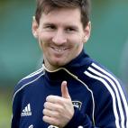 Argentina's forward Lionel Messi gives the thumb up during a training session in Ezeiza, Buenos Aires on March 19, 2013 ahead of the Brazil 2014 FIFA World Cup South American qualifier football match against Venezuela on March 22. AFP PHOTO / Ju...
