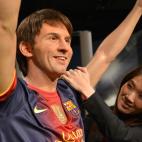 A Japanese woman inspects the wax figure of football star Lionel Messi at a press preview of Madame Tussauds museum in Tokyo on March 13, 2013. Tokyo's Madame Tussauds museum will exhibit some 60 wax figures of Japanese and foreign stars when it...