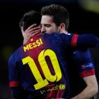 Barcelona's defender Jordi Alba, right, hugs teammate Lionel Messi, from Argentina, after he scored their second goal during the Champions League round of 16 second leg soccer match between FC Barcelona and AC Milan at Camp Nou stadium, in Barce...