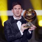 FC Barcelona's Argentinian striker Lionel Messi poses with the trophy after being awarded the FIFA Men's World Player of the Year during the FIFA Ballon d'Or Gala 2012 held at the Kongresshaus in Zurich, Switzerland, Monday, Jan 7, 2013. Messi w...