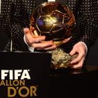 FIFA Ballon d'Or award winner Barcelona's Argentinian forward Lionel Messi holds his trophy during the FIFA Ballon d'Or awards ceremony at the Kongresshaus in Zurich on January 7, 2013. AFP PHOTO / OLIVIER MORIN (Photo credit should rea...