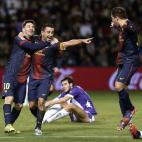 Barcelona's midfielder Xavi Hernandez (C) celebrates with Barcelona's Argentinian forward Lionel Messi (L) and Barcelona's defender Jordi Alba after scoring during the Spanish league football match Valladolid vs FC Barcelona at the Jose Zorilla ...