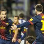 VALLADOLID, SPAIN - DECEMBER 22: Xavi Hernandez of FC Barcelona celebrates with his teammate Lionel Messi after scoring against Real Valladolid during the La Liga game between Real Valladolid and FC Barcelona at Jose Zorrilla on December 22, 20...