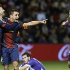 Barcelona's midfielder Xavi Hernandez (C) celebrates with Barcelona's Argentinian forward Lionel Messi (L) and Barcelona's defender Jordi Alba after scoring during the Spanish league football match Valladolid vs FC Barcelona at the Jose Zorilla ...