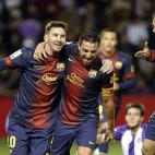 Barcelona's midfielder Xavi Hernandez (C) celebrates with Barcelona's Argentinian forward Lionel Messi (L) and Barcelona's defender Jordi Alba after scoring during the Spanish league football match Valladolid vs FC Barcelona at the Jose Zorilla ...