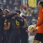 Barcelona's Lionel Messi celebrates with teammates after scoring against Cordoba during the 1st leg of a last-16 Copa del Rey soccer match at Arcangel stadium in, Cordoba, Spain on Wednesday, Dec. 12, 2012. (AP Photo/Angel Fernandez)