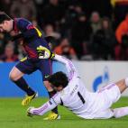 Barcelona's Argentinian forward Lionel Messi (L) is injured while vying with Benfica's Brazilian goalkeeper Artur Moraes during the UEFA Champions League football match FC Barcelona vs SL Benfica at the Camp Nou stadium in Barcelona on December ...