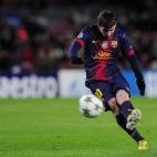Barcelona's Argentinian forward Lionel Messi kicks the ball during the UEFA Champions League football match FC Barcelona vs SL Benfica at the Camp Nou stadium in Barcelona on December 5, 2012. AFP PHOTO / LLUIS GENE (Photo credit should ...
