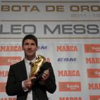 Barcelona's Argentinian forward Lionel Messi poses after receiving the European Golden Boot 2012 award for best European goalscorer of the 2011-2012 season, on October 29, 2012 in Barcelona. Messi scored a Spanish-league record of 50 goals for B...