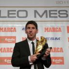 Barcelona's Argentinian forward Lionel Messi poses after receiving the European Golden Boot 2012 award for best European goalscorer of the 2011-2012 season, on October 29, 2012 in Barcelona. Messi scored a Spanish-league record of 50 goals for B...