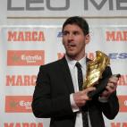 Barcelona's Argentinian forward Lionel Messi poses after receiving the European Golden Boot 2012 award for best European goalscorer of the 2011-2012 season, on October 29, 2012 in Barcelona. Messi scored a Spanish-league record of 50 goals for B...