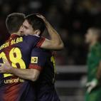 FC Barcelona's Lionel Messi from Argentina, second left, celebrates his goal with Jordi Alba, left, during a Spanish La Liga soccer match against Rayo Vallecano at the Teresa Rivero stadium in Madrid, Spain, Saturday, Oct. 27, 2012. (AP Photo/An...